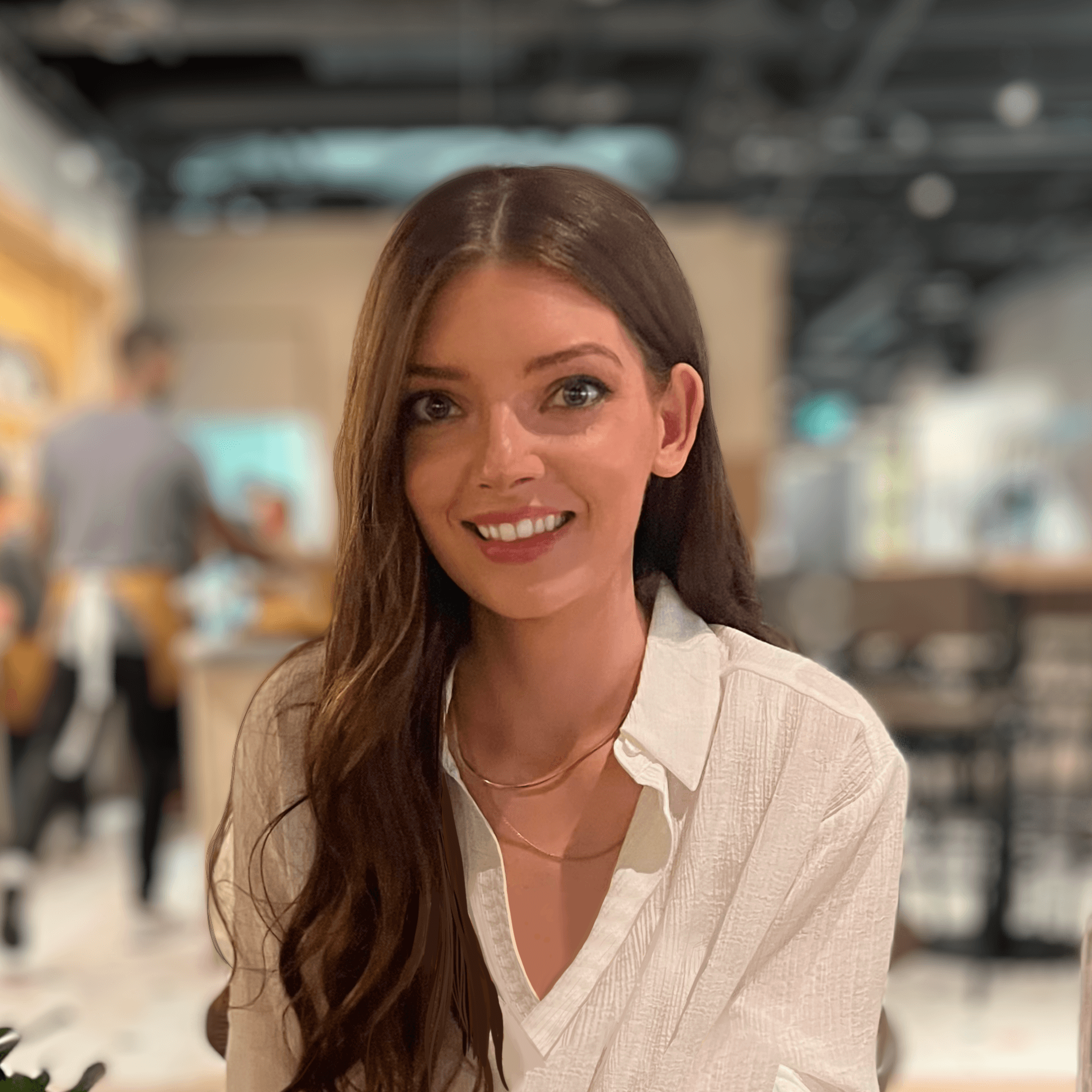 Amanda smiling at camera with an unfocused background